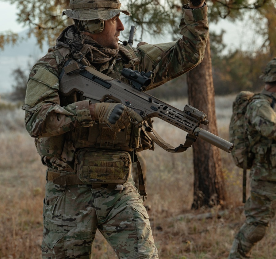 Shooter firing rifle illustrating the control versus power compromise