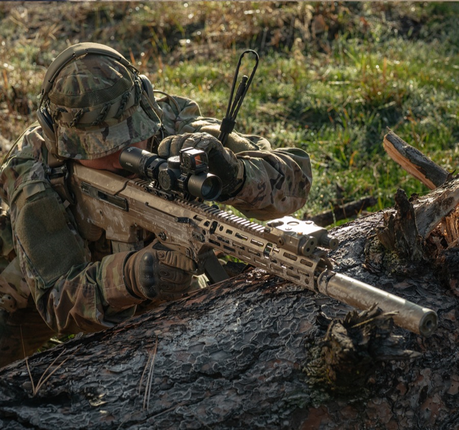 Camouflaged marksman representing trusted-by-those-entrusted use