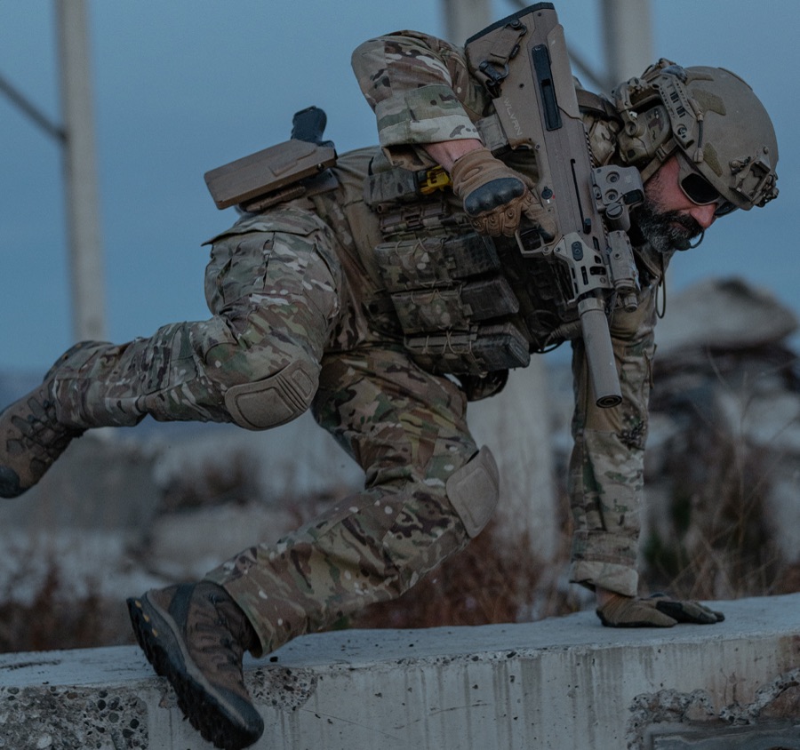 Shooter moving with rifle illustrating the mobility versus lethality compromise